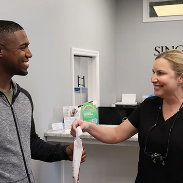 Dawn with a patient at Singing River Dentistry.