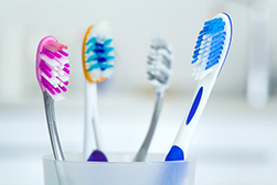 close up of a selection of different toothbrushes