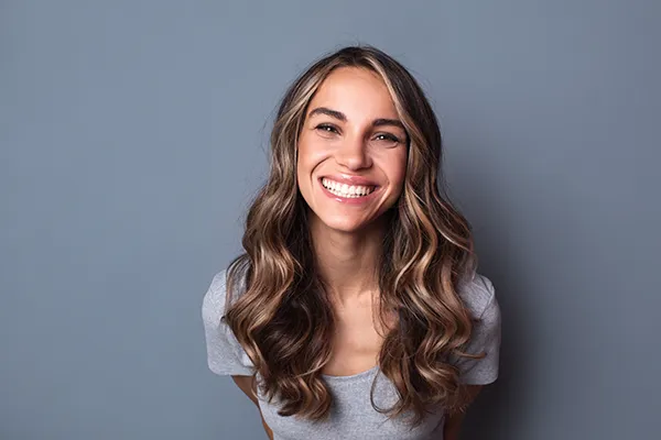 Blonde woman smiling after getting her teeth whietened