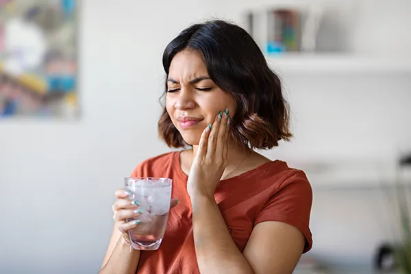 Woman holding jaw